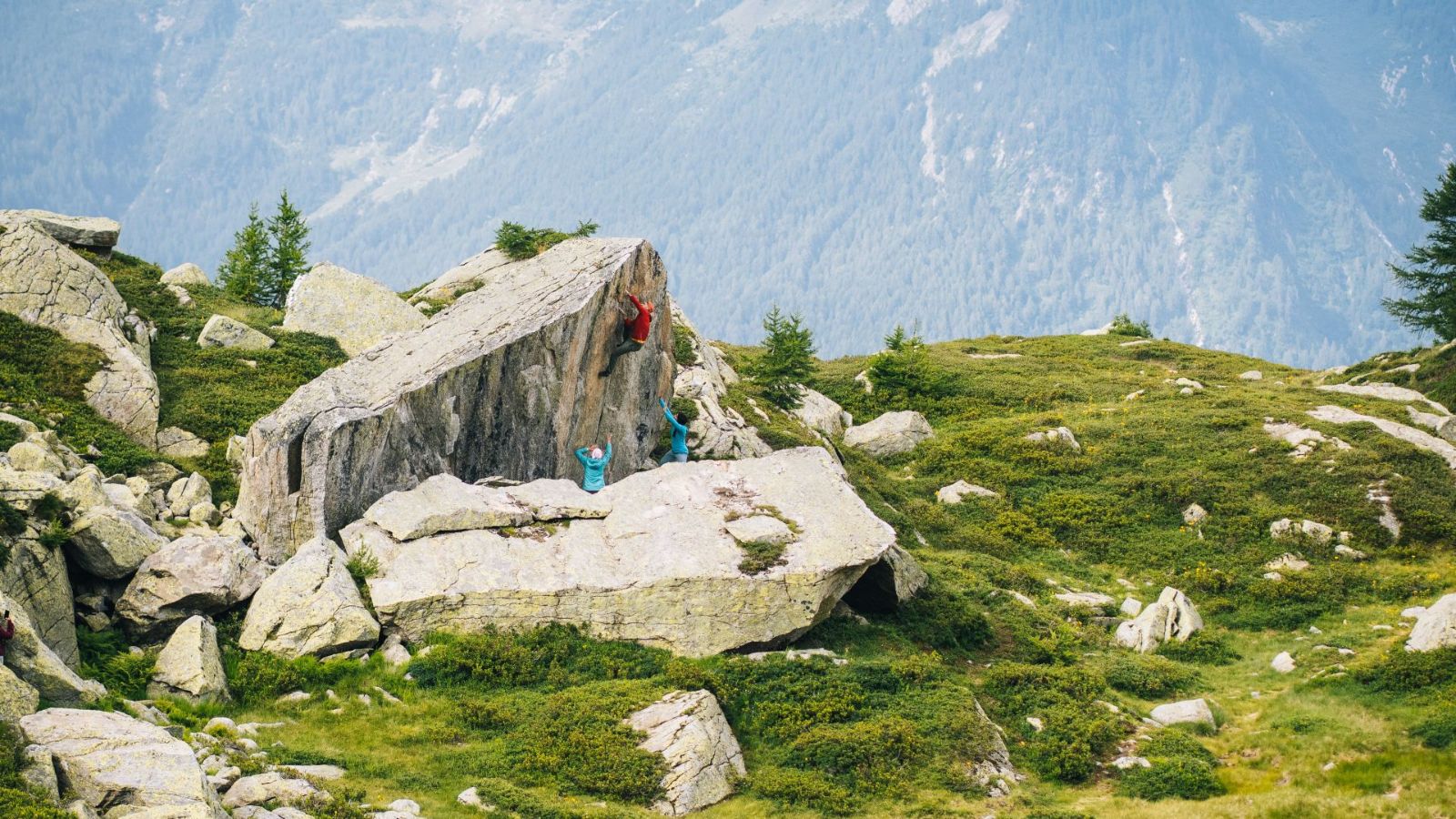 Bouldering with the Ticino Alps in the background